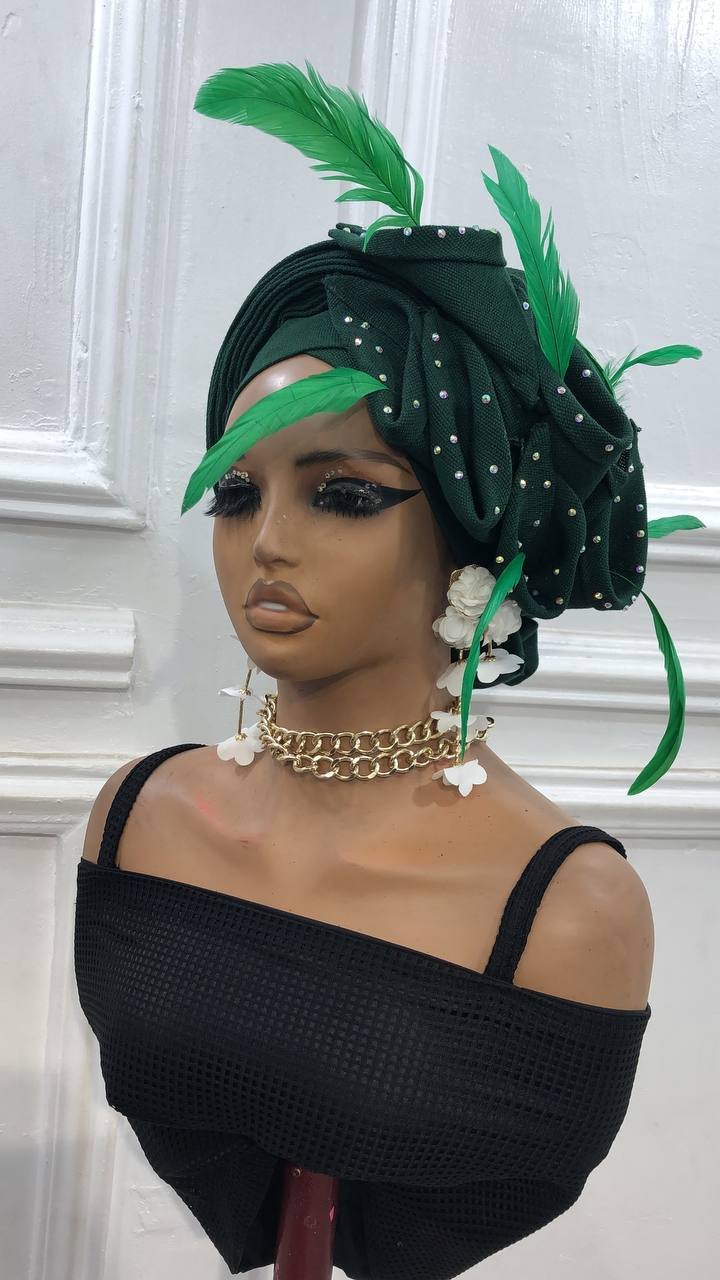The Feathered Green Turban is a luxury headpiece made for women's elegance.